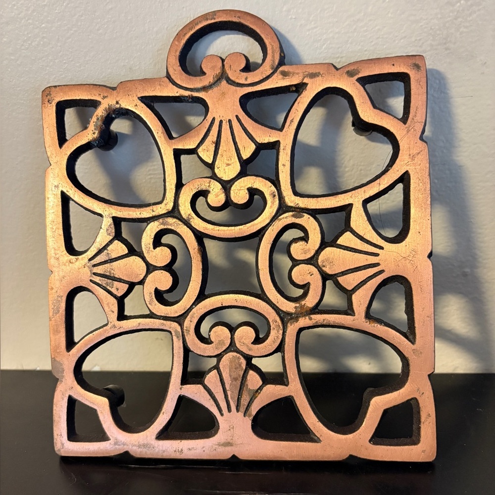 Pampered Chef metal, copper finish trivet.